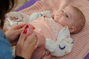 A photograph from a Family Hub baby massage session.